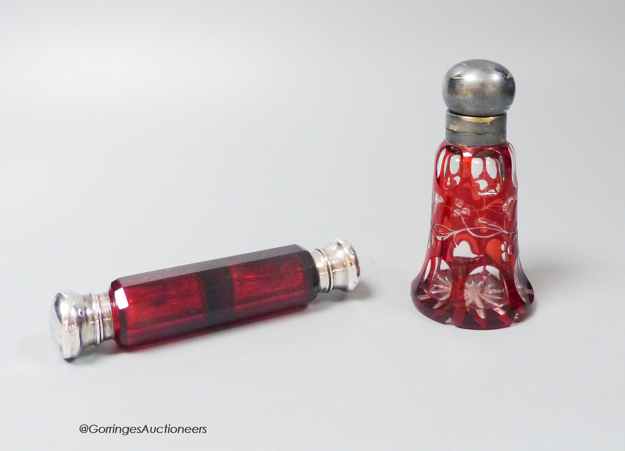 A Victorian ruby glass double silver mounted scent bottle and a plate mounted flash cut ruby scent bottle (2)